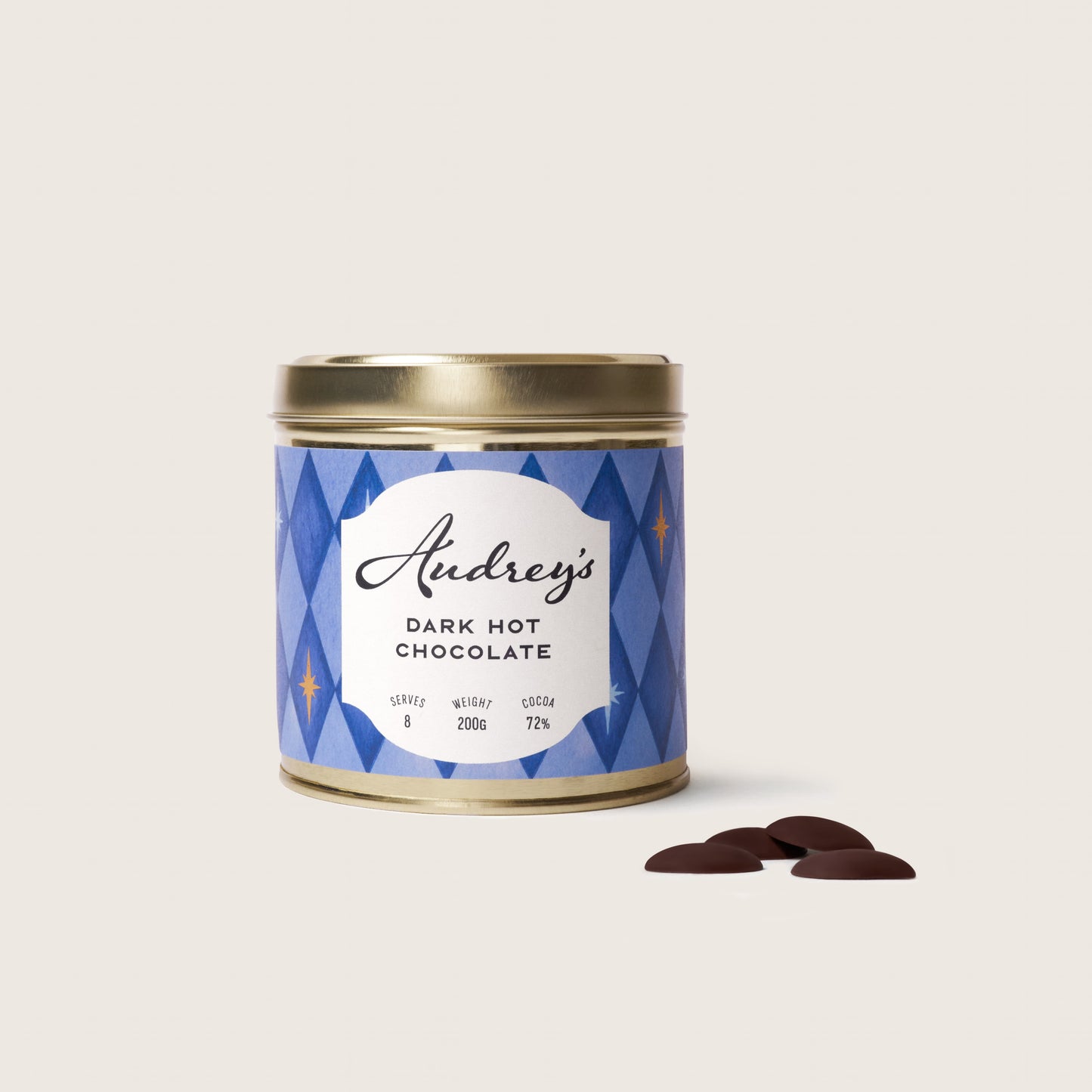 Tin of Audrey's Dark Hot Chocolate with decorative label on a light background