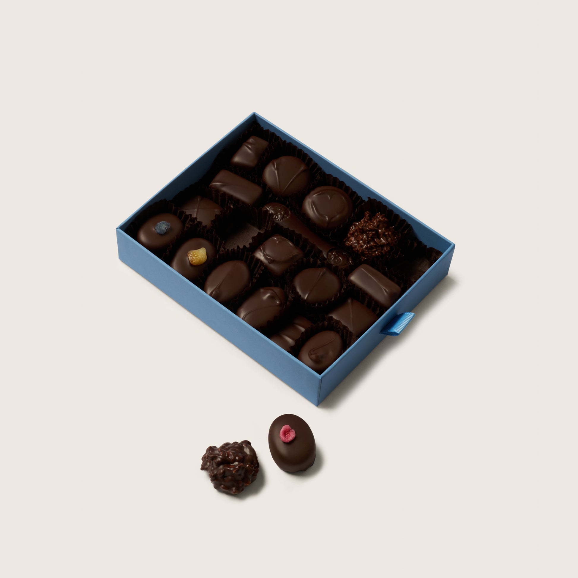 Box of chocolates on a light beige background