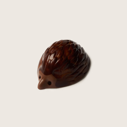 Chocolate hedgehog on a beige background