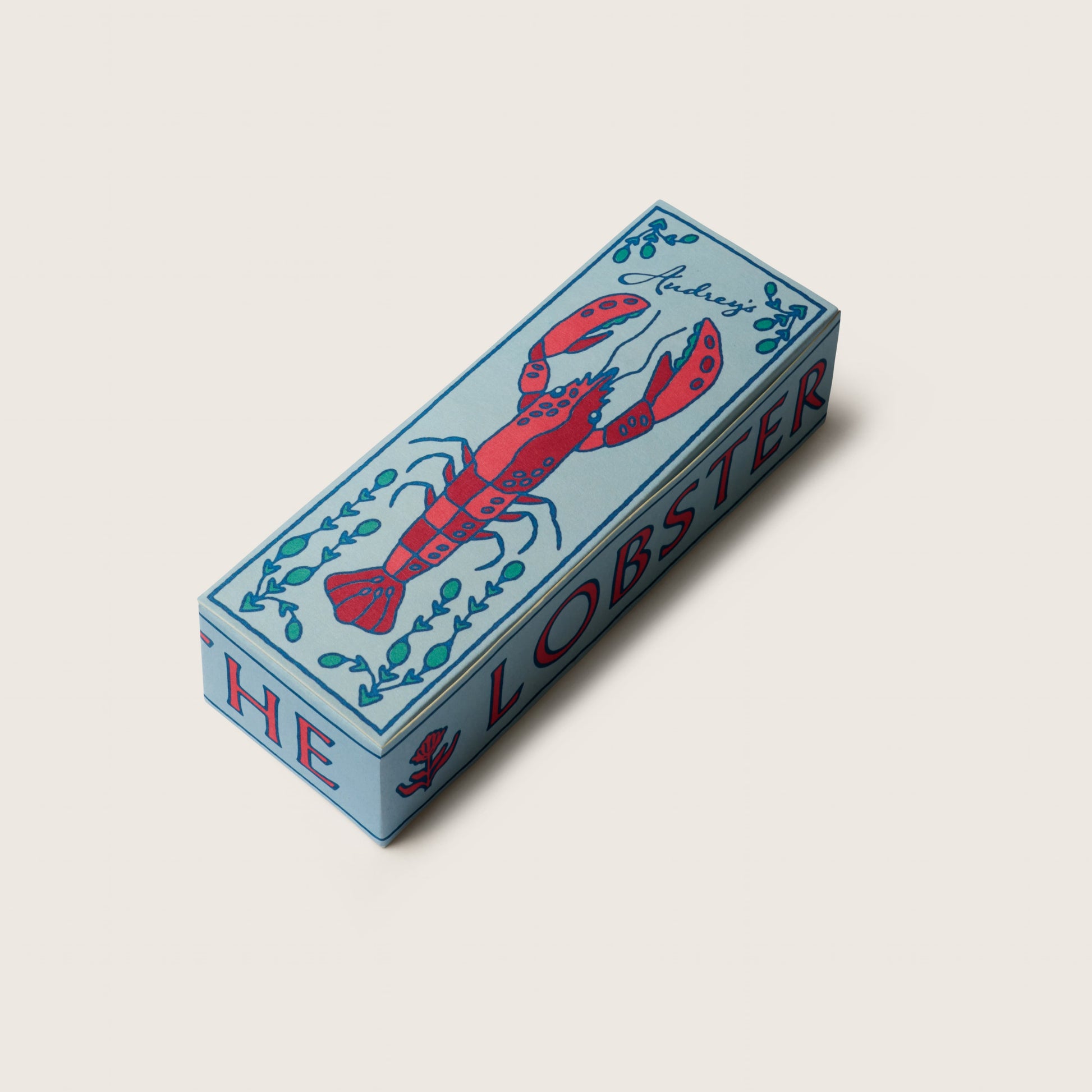 Box with a lobster design on a light gray background