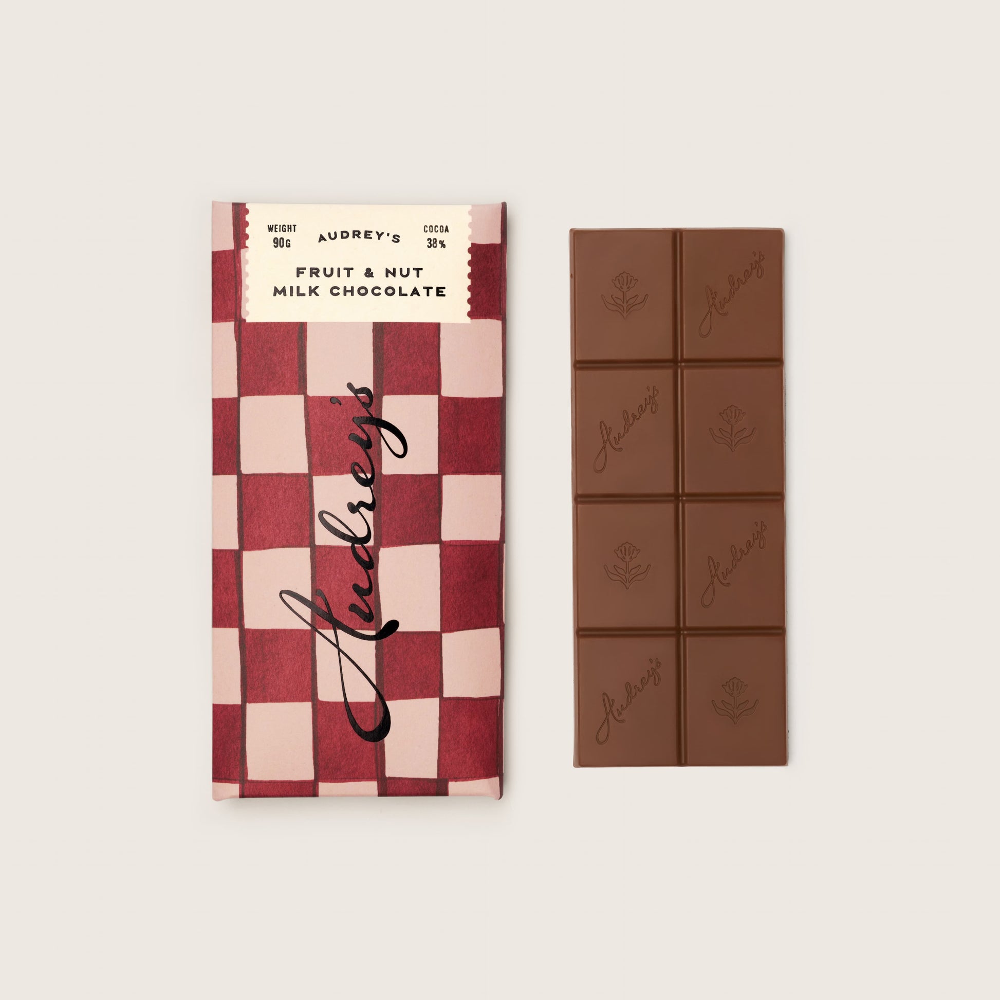 Chocolate bar with checkered packaging and visible brand name on a light background